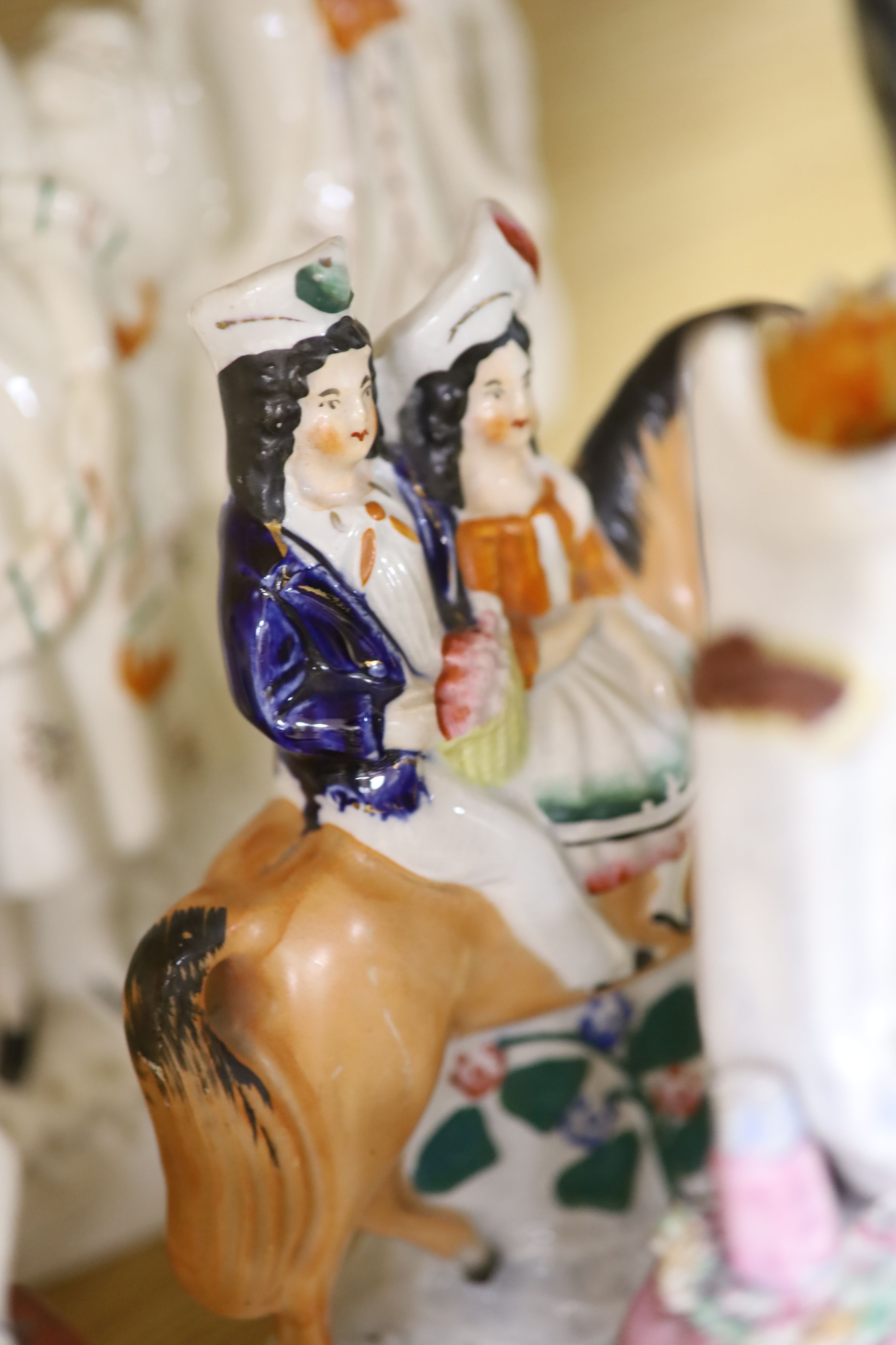 A collection of assorted Staffordshire figures and sundry ceramics including mid 18th century Staffordshire deer, tallest 33cm